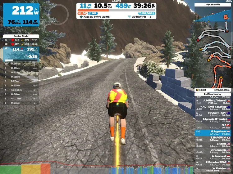 Screenshot of Marcel riding his new Tron bike up a mountain in Zwift.